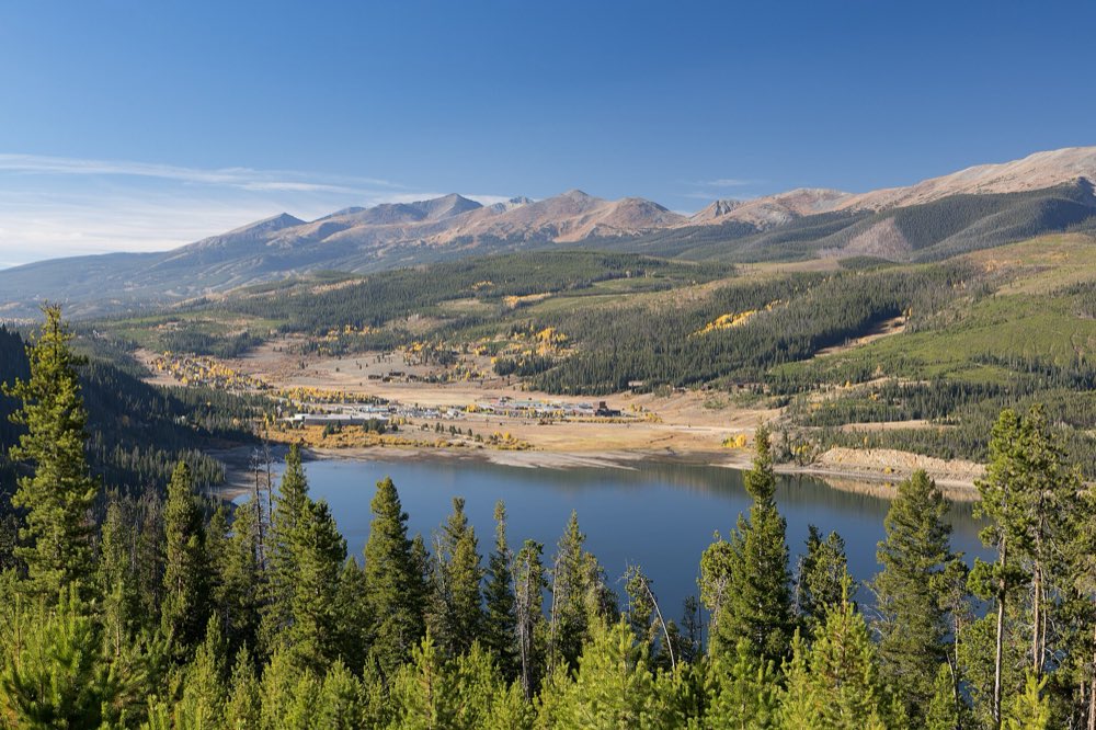 The Blue River arm of Dillon Reservoir below the Tenmile Range, with golden aspens on the forested slopes